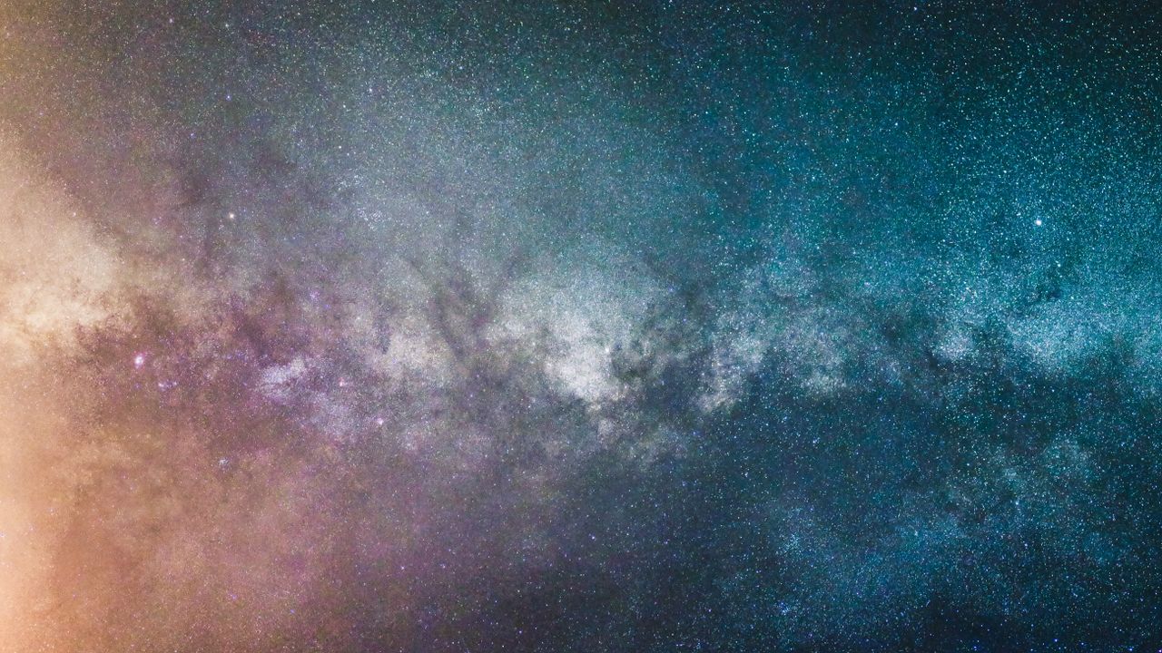 Home Stunning view of the Milky Way galaxy at night, showcasing countless stars and cosmic colors.